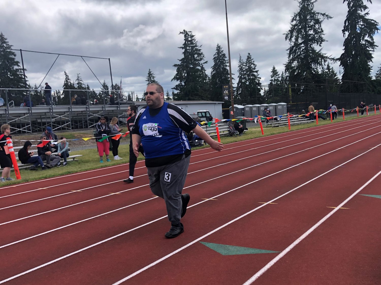 Alex Salter is shown in the final stretch of his race at the Washington State Special Olympics Track and Field Games on Sunday, June 19, 2022.